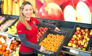 shop-assistant-with-fruits-in-pennymarket